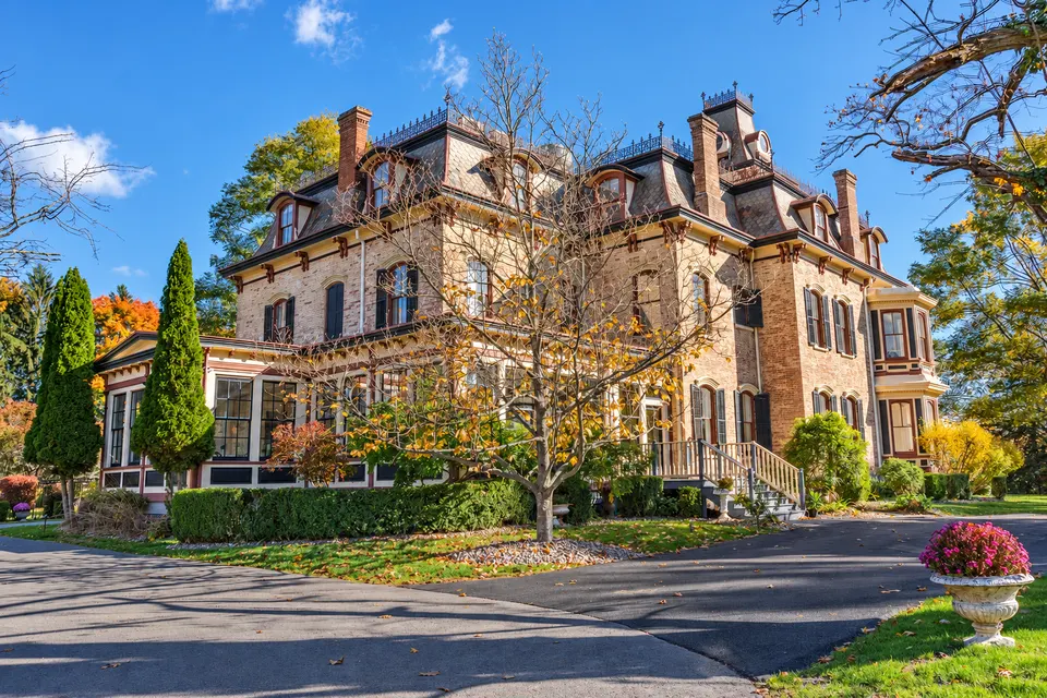 Second Empire stone mansion with a mansard roof